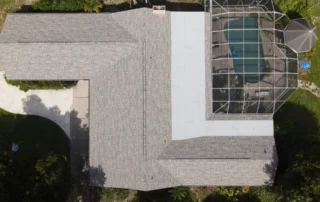 DJI 0030 shingle and flat roof sections on home with pool